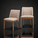 Set of two Surya Brooke dining chairs with medium brown polyester upholstery and wheat-finished beechwood bases.