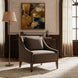 Brown recycled fabric accent chair with a rubber wood base in a living room setting.