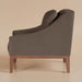 Surya Casey accent chair with dark brown recycled fabric upholstery and a rubber wood base.