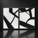 Two framed black and white abstract wall art pieces with bold lines, hand-painted on canvas.