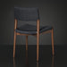 Surya Chia Dining Chair with brown stained ash wood base and dark woven seat and back.