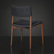 Surya Chia Dining Chair with brown stained ash wood base and dark woven seat and back.