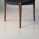 Surya Chia dining chair with brown stained ash wood base and black woven seat.