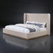 Surya Covina upholstered bed with oatmeal linen blend fabric and brown rubber wood base.