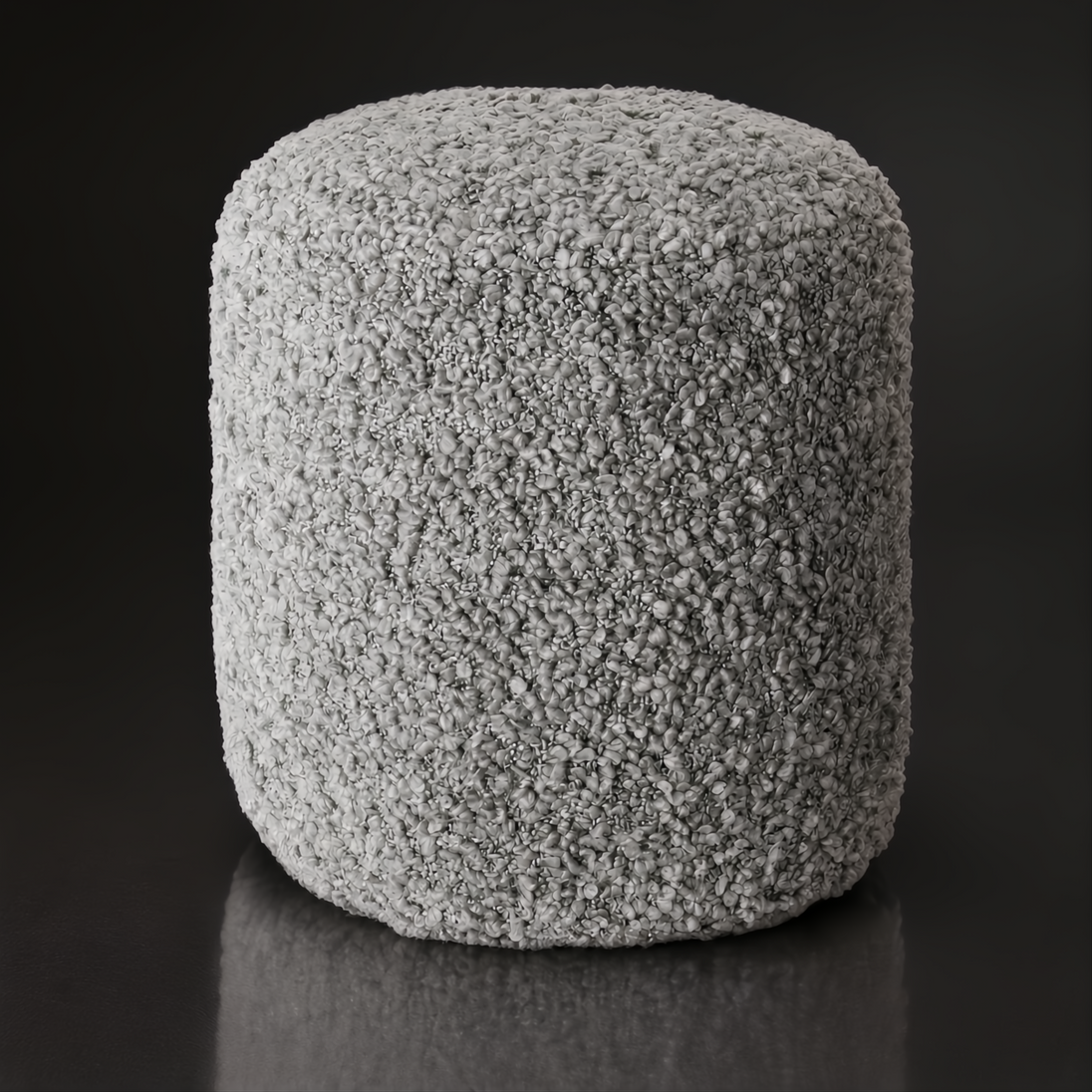 Light grey textured Surya Mohave pouf with a durable polyester top and soft cotton base.