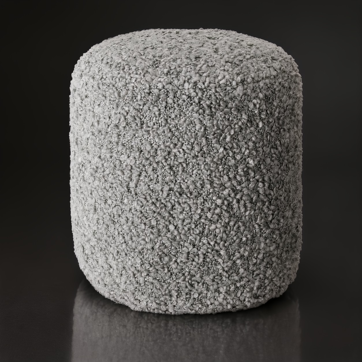 Light grey textured Surya Mohave pouf with a durable polyester top and soft cotton base.