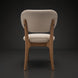 Surya Devin Dining Chair, cream polyester upholstery with wheat-colored beechwood base, back view.