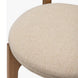 Surya Devin Dining Chair with cream polyester upholstery and a wheat-colored beechwood base.