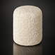 Surya Mohave Pouf: Off-white bouclé-style fabric pouf with rounded top and bottom on a dark background.