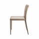 Surya Eric dining chair with light brown PVC upholstery and khaki iron base, side view.