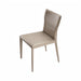 Surya Eric Dining Chair with light brown PVC upholstery and khaki iron base.