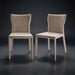 Set of two Surya Eric dining chairs with light brown PVC upholstery and a sleek, armless design.