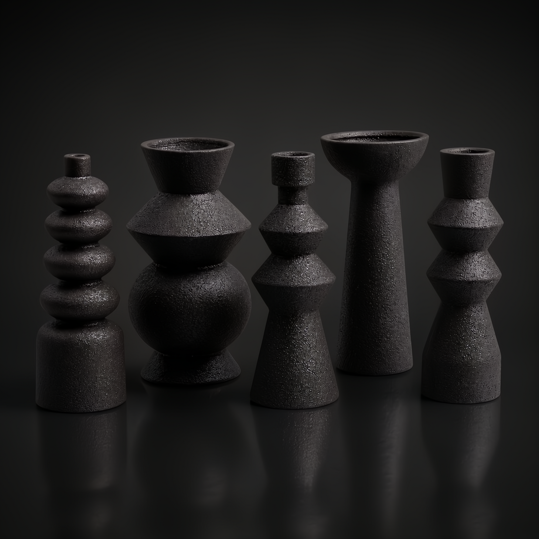 Surya Konark KNK-001 black ceramic vase set, five global-inspired decorative accents with varied shapes and textures.