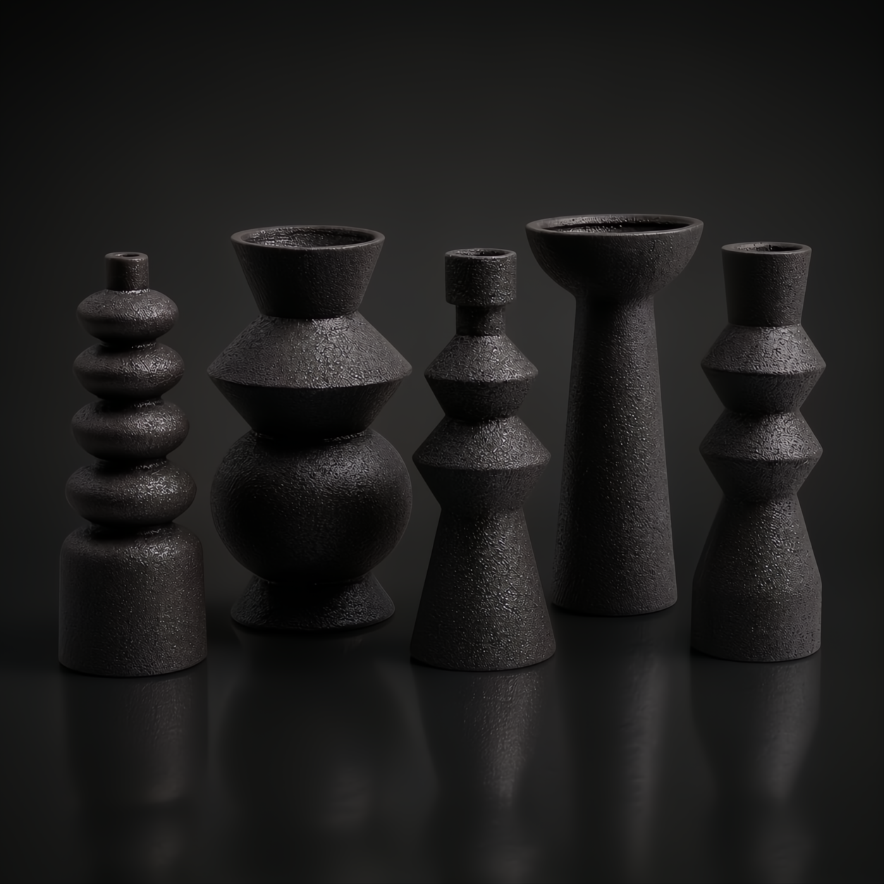 Surya Konark KNK-001 black ceramic vase set, five global-inspired decorative accents with varied shapes and textures.