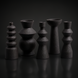 Surya Konark KNK-001 black ceramic vase set, five global-inspired decorative accents with varied shapes and textures.