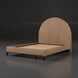 Surya Elipse upholstered bed with a beige arched headboard, dark brown stained base, and wooden slats.