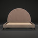 Surya Elipse upholstered bed with a large, curved headboard and dark brown fabric.