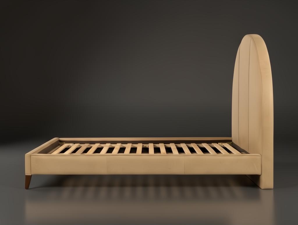 Surya Elipse upholstered bed with a tall, curved headboard and light tan aniline dyed leather.