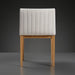 Surya Joanne dining chair with off-white channel-tufted polyester upholstery and wheat rubber wood base.