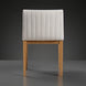 Surya Joanne dining chair with off-white channel-tufted polyester upholstery and wheat rubber wood base.