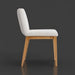 Surya Joanne dining chair with off-white polyester upholstery and wheat rubber wood base, side view.