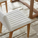 Surya Joanne dining chair with off-white ribbed polyester upholstery and wheat rubber wood base.
