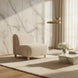 Off-white polyester accent chair with a brown rubber wood base in a modern living room.