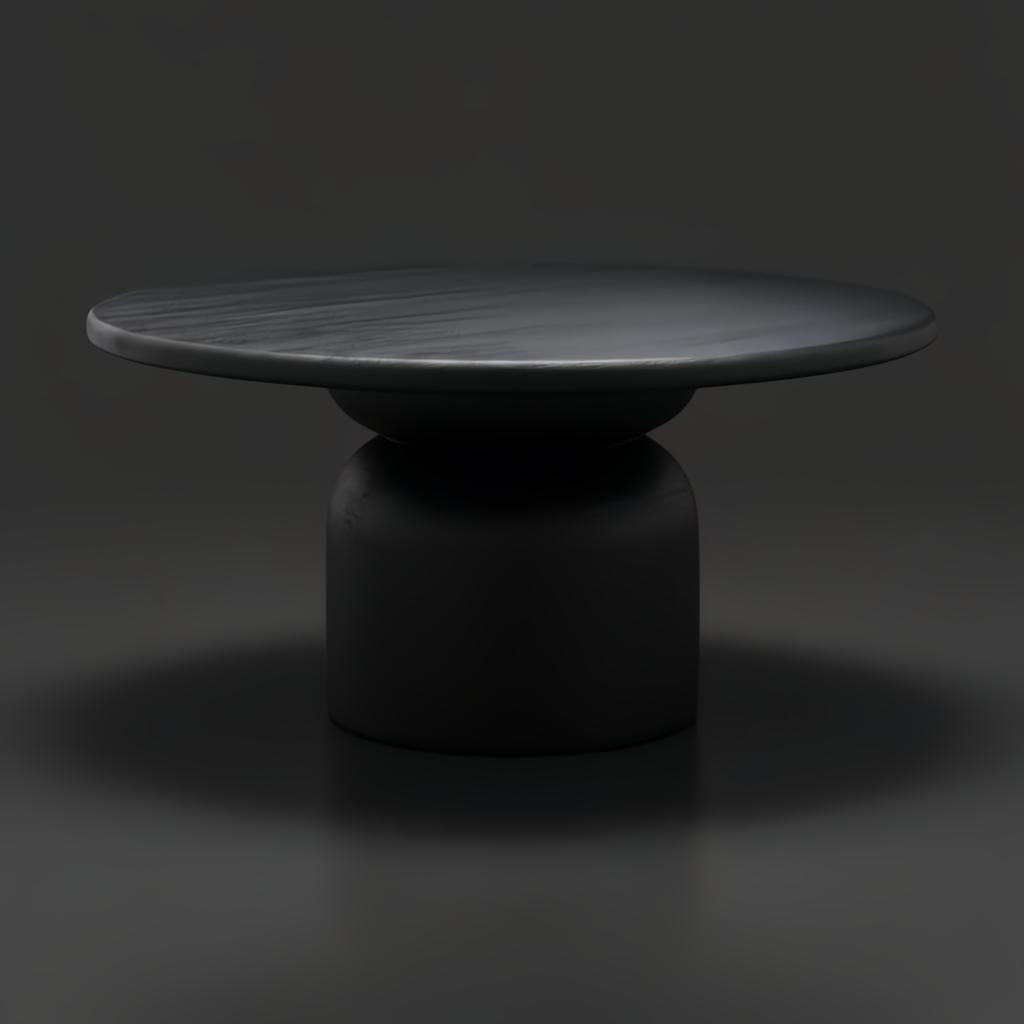 Surya Koben 60" round black brushed mango wood dining table with a turned base.