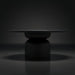 Surya Koben 60" round black brushed mango wood dining table with a turned base.
