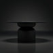 Surya Koben 60" round black brushed mango wood dining table with a turned base.