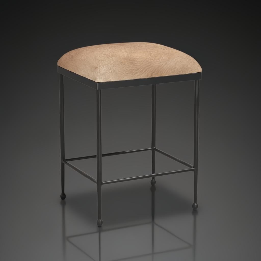 Surya Kornel counter stool with a black iron frame and a light brown, furry seat.