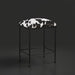 Surya Kornel counter stool with a black iron frame and a black and white cowhide-patterned seat.