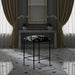 Surya Kornel counter stool with black iron frame and cowhide-patterned seat in a luxurious room.