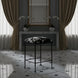 Surya Kornel counter stool with black iron frame and cowhide-patterned seat in a luxurious room.