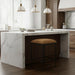 Surya Kornel counter stool with a brown polyester seat and black powder-coated iron base in a kitchen.