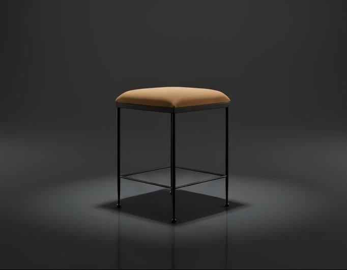 Surya Kornel counter stool with a tan polyester seat and black powder-coated iron base, rustic industrial style.