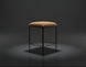 Surya Kornel counter stool with a tan polyester seat and black powder-coated iron base, rustic industrial style.