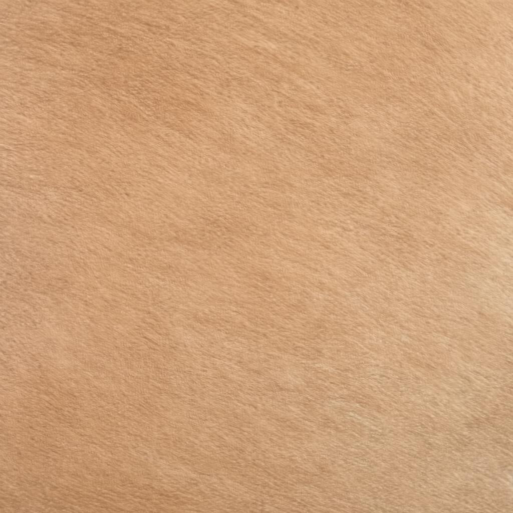 Close-up of a light brown, short-pile faux fur or plush fabric texture.