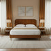 Surya Madri brown stained poplar wood bed with a minimalist modern design in a bedroom setting.