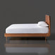 Surya Madri brown stained poplar wood bed with a minimalist modern design and white bedding.