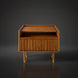 Brown Surya Madri nightstand with a poplar top, fluted drawer, open shelf, and gold-capped tapered legs.