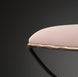 Close-up of a Surya Misho ottoman with a light pink polyester cushion and metallic copper iron frame.