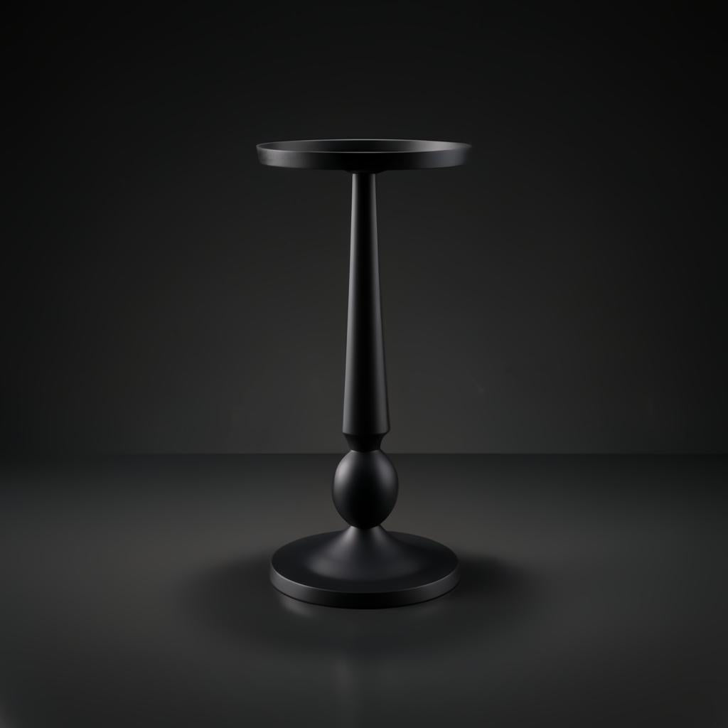 Black aluminum Surya Molino end table with a round top, slender pedestal, and circular base.