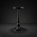 Black aluminum Surya Molino end table with a round top, slender pedestal, and circular base.