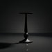 Surya Molino black aluminum end table with a compact pedestal design, 21"H.