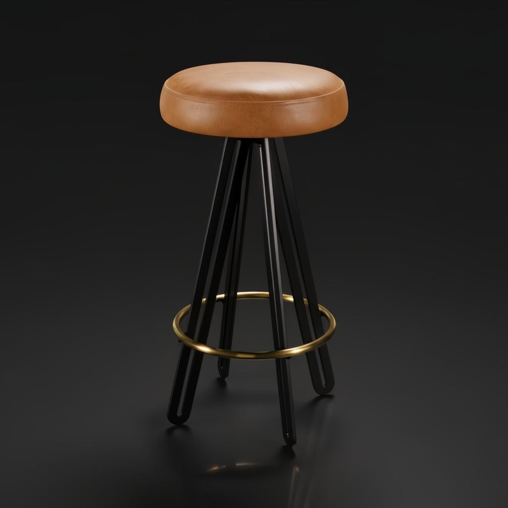 Surya Oberon backless bar stool with brown leather seat, black steel base, and brass footrest.