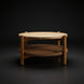 Surya Orly round mango wood coffee table with a wheat brown base and paper rope shelf.