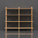 Wide, light brown mango wood bookcase with four shelves and a clean, natural design.
