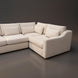 Cream-colored sectional sofa with textured polyester upholstery, plush cushions, and five pillows.
