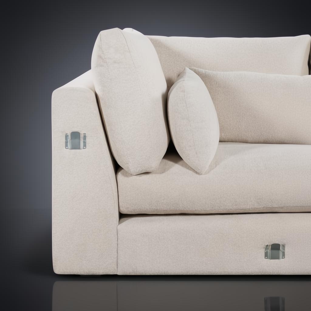 Close-up of a light brown polyester sectional sofa with plush cushions and silver connecting hardware.